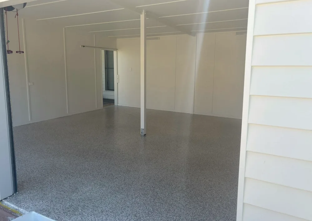 Seamless flake-epoxy flooring finished inside a garage