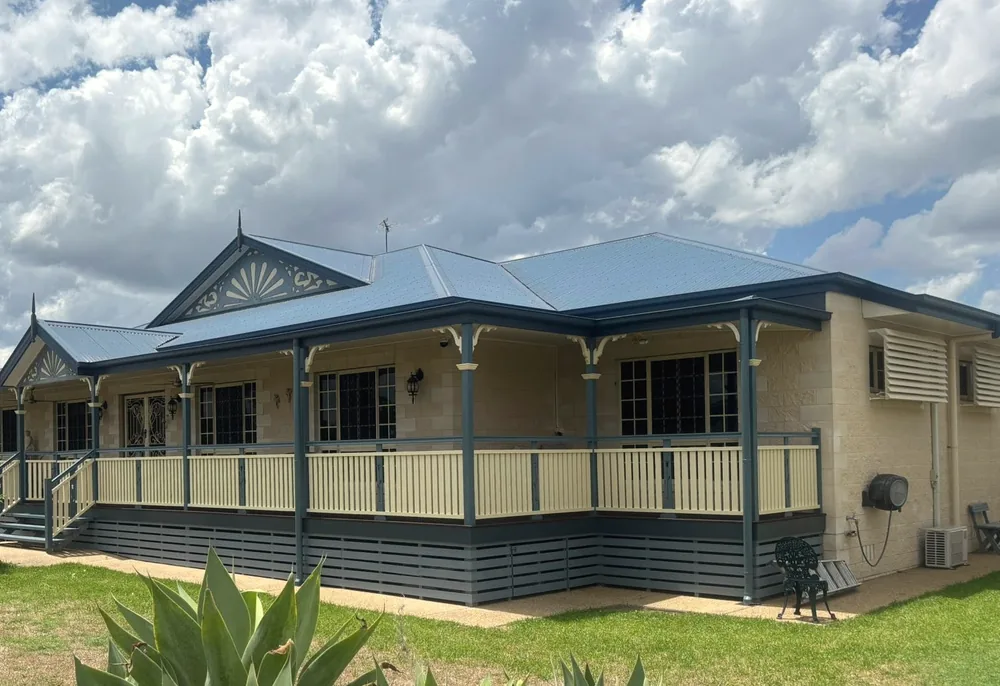 Fretwork gable and turned verandah posts, freshly painted
